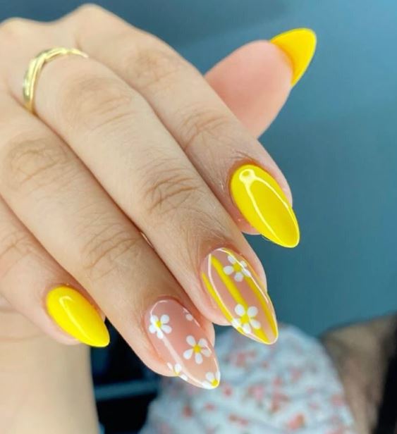 Unhas amarelas com arte moderna e criativa.