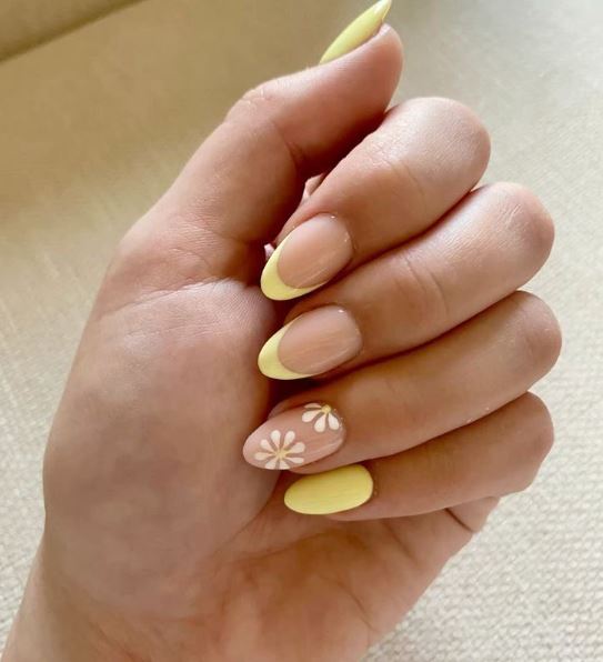 Unhas amarelas com acabamento profissional.